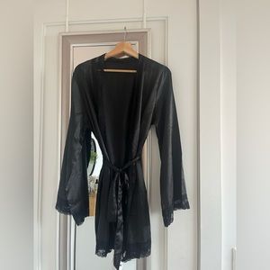 Woman’s black bathrobe